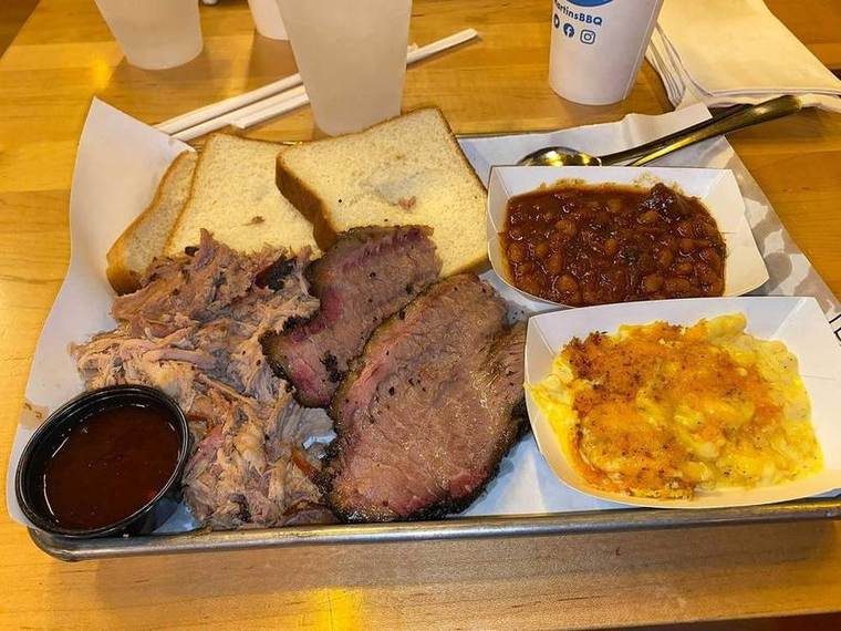 Pulled pork, brisket, baked beans, and mac & cheese plate from a Nashville barbecue restaurant