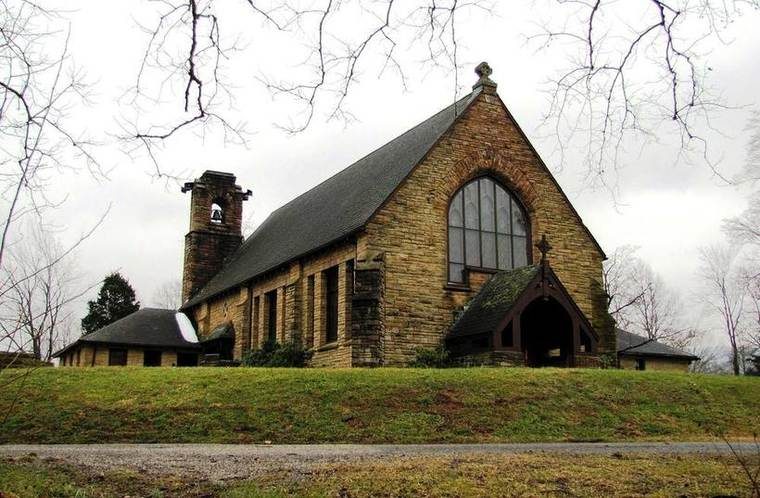 A white wood-frame church building built in 1934 on the grounds of the former Alpine Institute, where a congregation still meets.