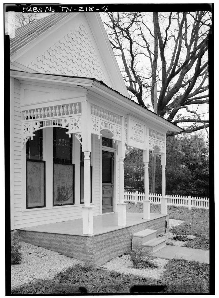 A detail view of the south front porch of the Governor Albert H. Roberts Law Office in Livingston, Tennessee, seen from the southwest, showing its columns and roofline.